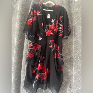 Red floral kimono style dress with elastic belt and silver detail. Size 20.